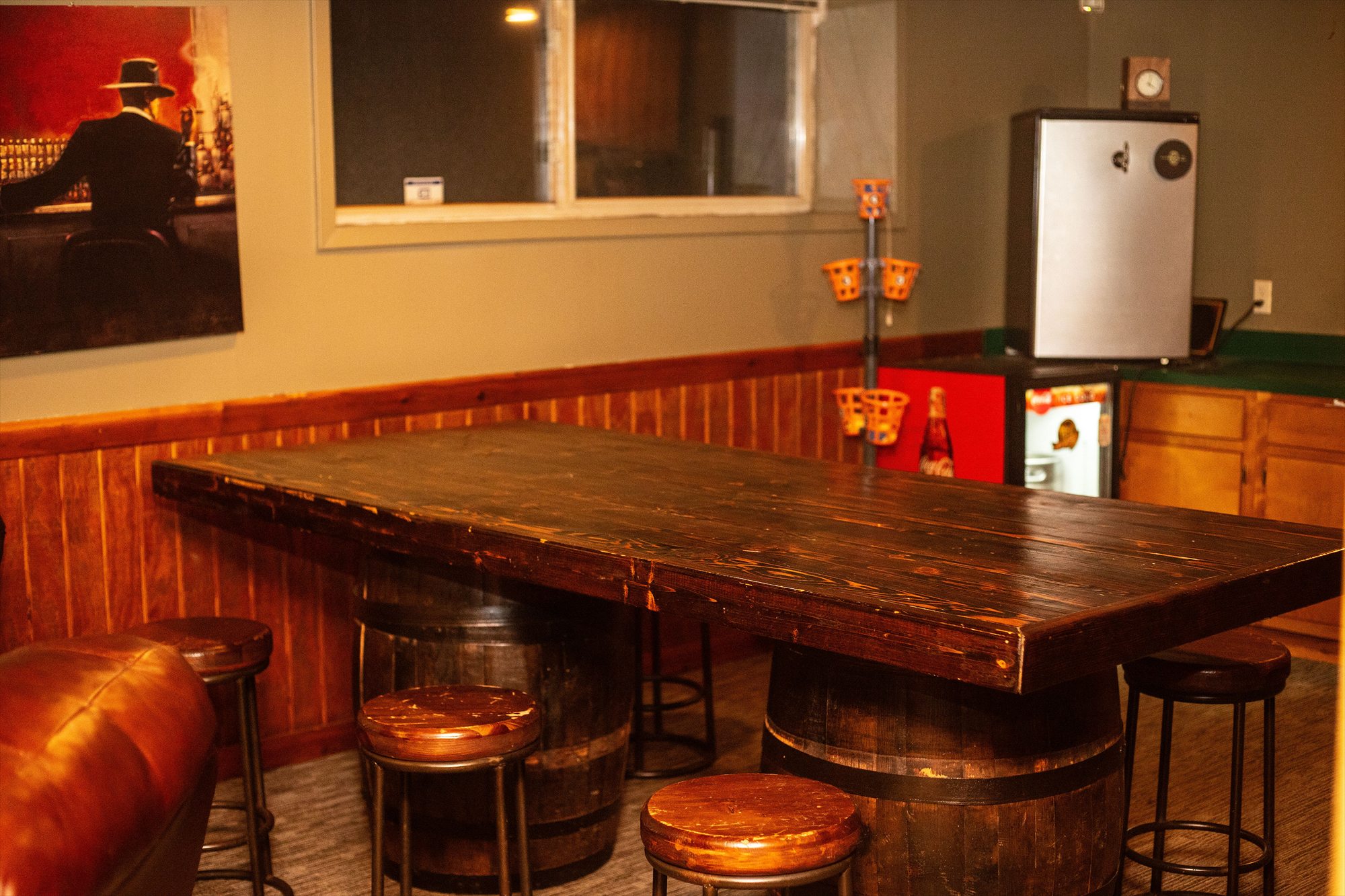 The barrel-style gathering table in Hearth's downstairs lounge