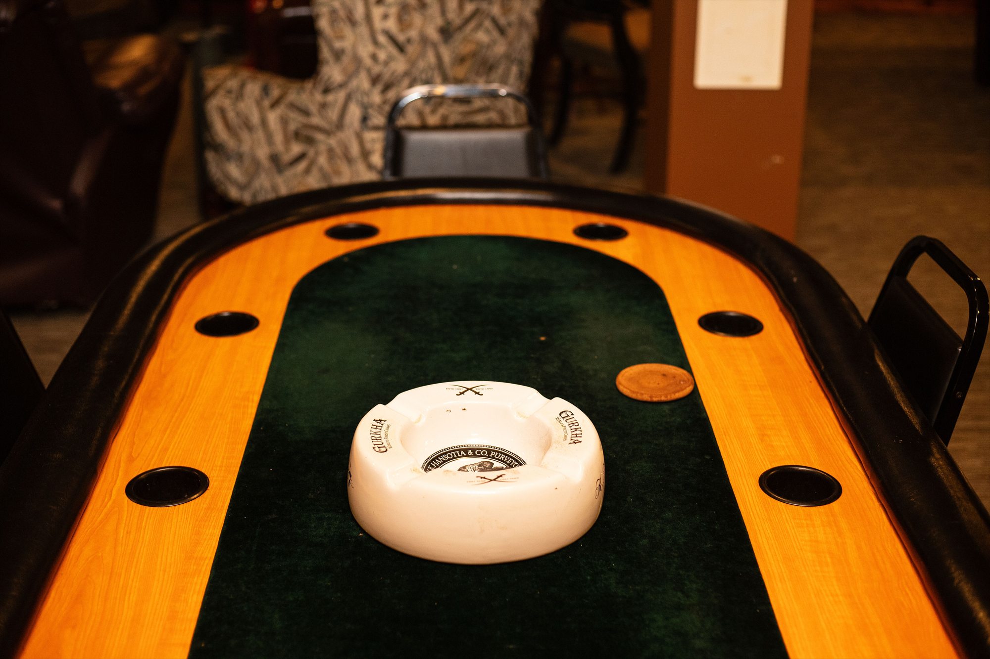 The poker table and cigar details downstairs at Hearth